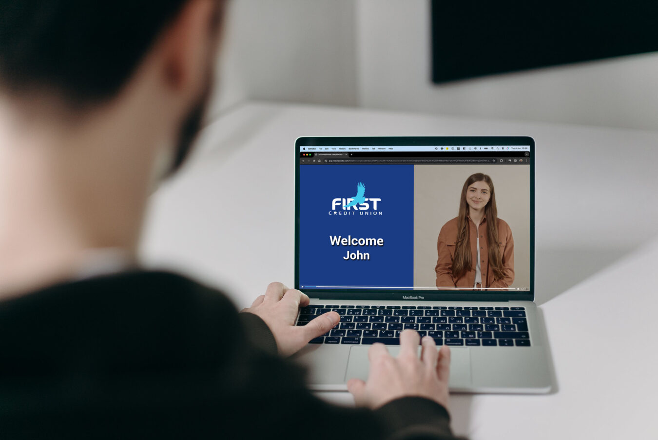 Male playing personalized video on Laptop