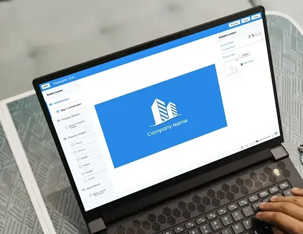 A laptop featuring a real estate property management software interface, showing options for property details, photos, layouts, and agent contact, placed on a patterned table for a professional working setup.